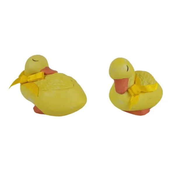 Gule andefigurer med sløjfer