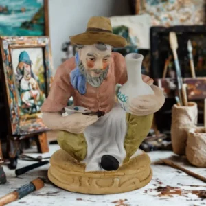 Figur af pottemager med sit varme udtryk
