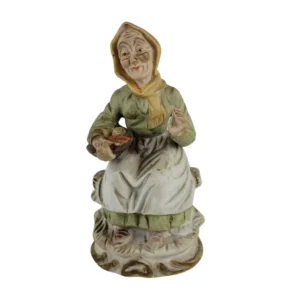 Retro figur af ældre dame med frugtskål