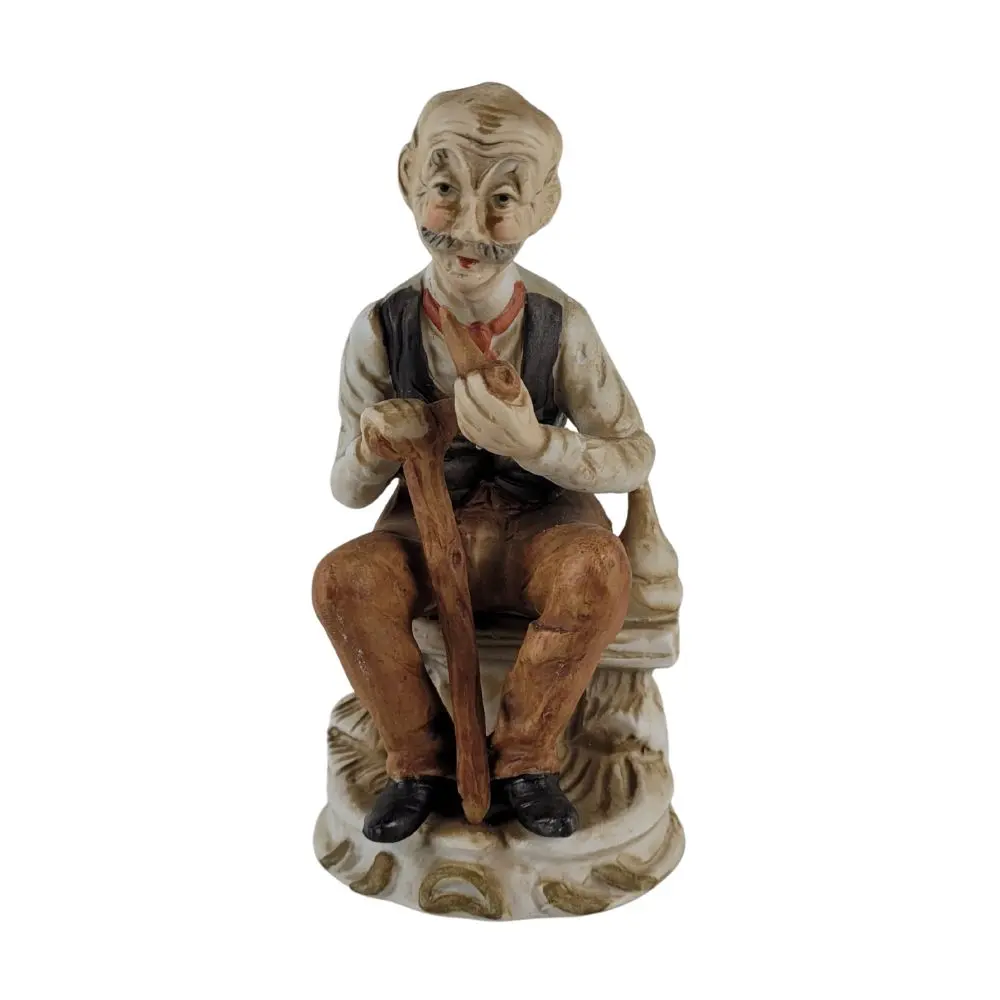 Retro figur af ældre mand med stok og pibe