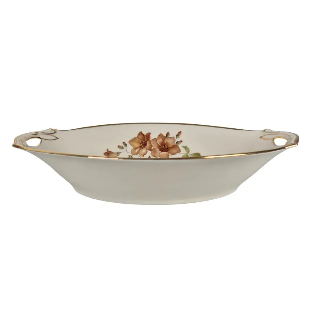 Oval porcelænsskål med hank fra siden